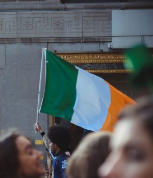 Man holding the Irish flag.